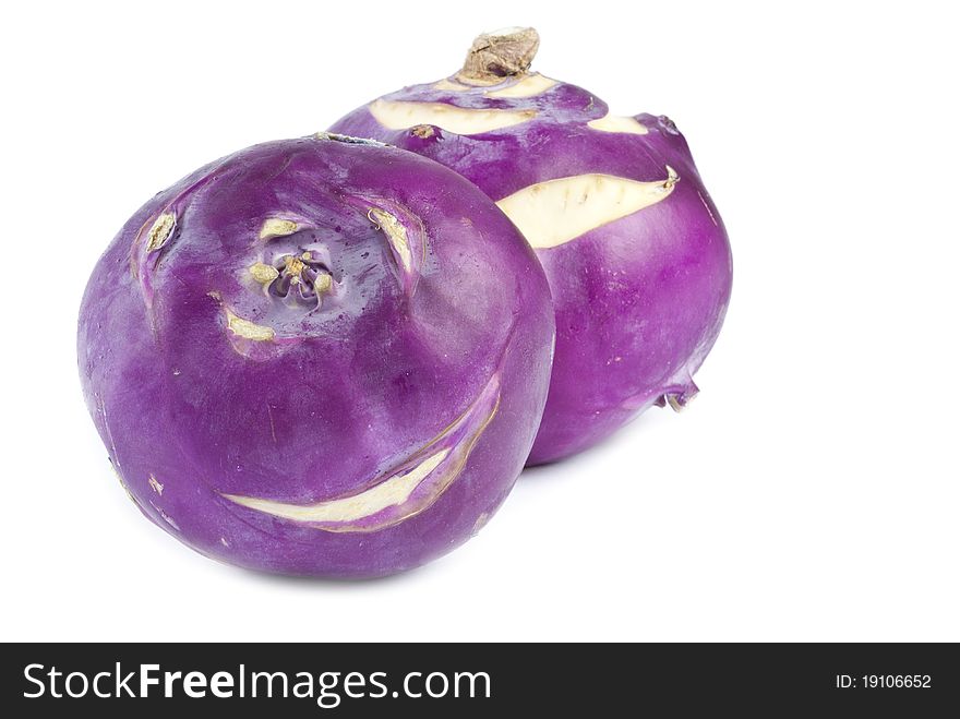 Two purple kohlrabi isolated on white.