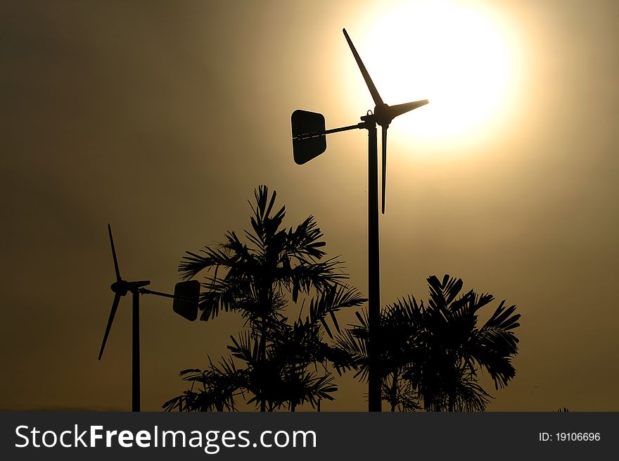 Wind turbine  over sunset