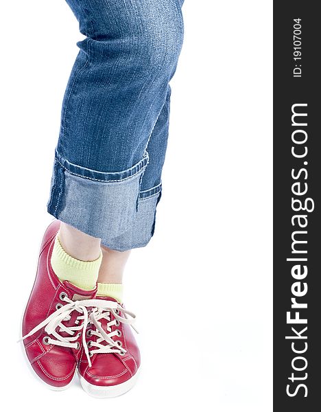 Woman showing off her new red leather running shoes, isolated on white. Woman showing off her new red leather running shoes, isolated on white.