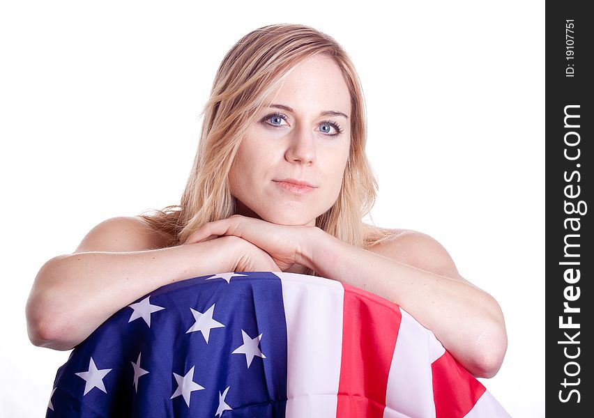 A cute girl poses with an American Flag. A cute girl poses with an American Flag