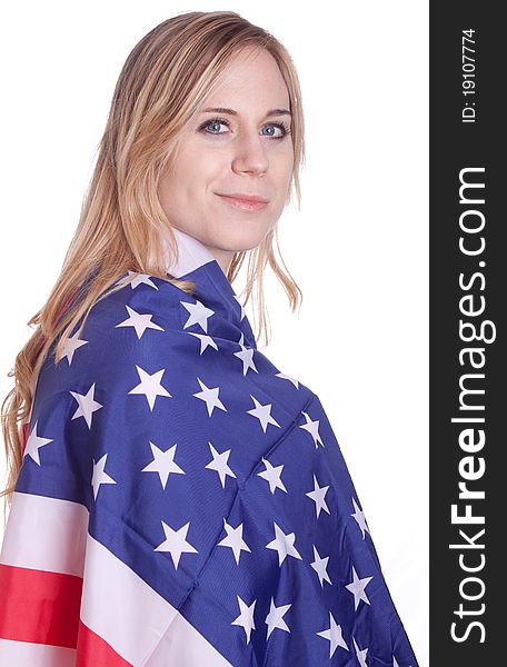 A girl is covered with an American flag. A girl is covered with an American flag.