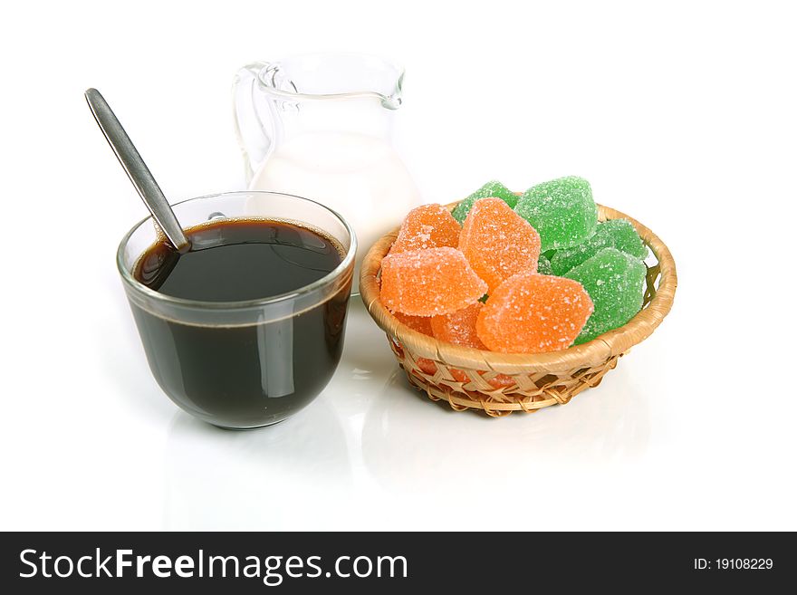 Coffee with milk and sugar parts on a white background with reflexion