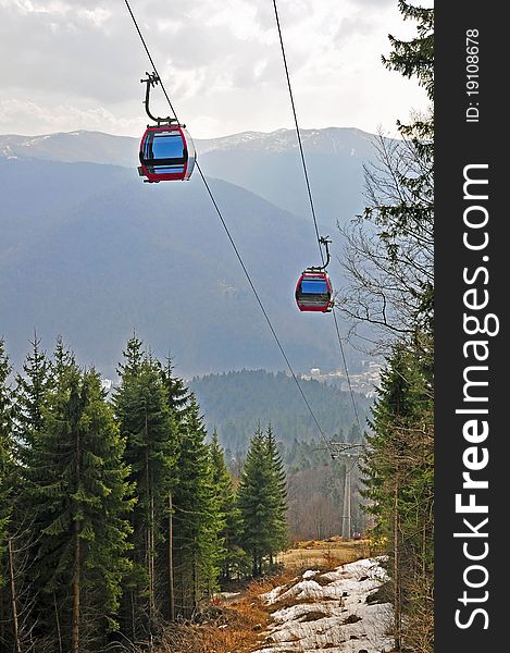 Twin cable car through the forest