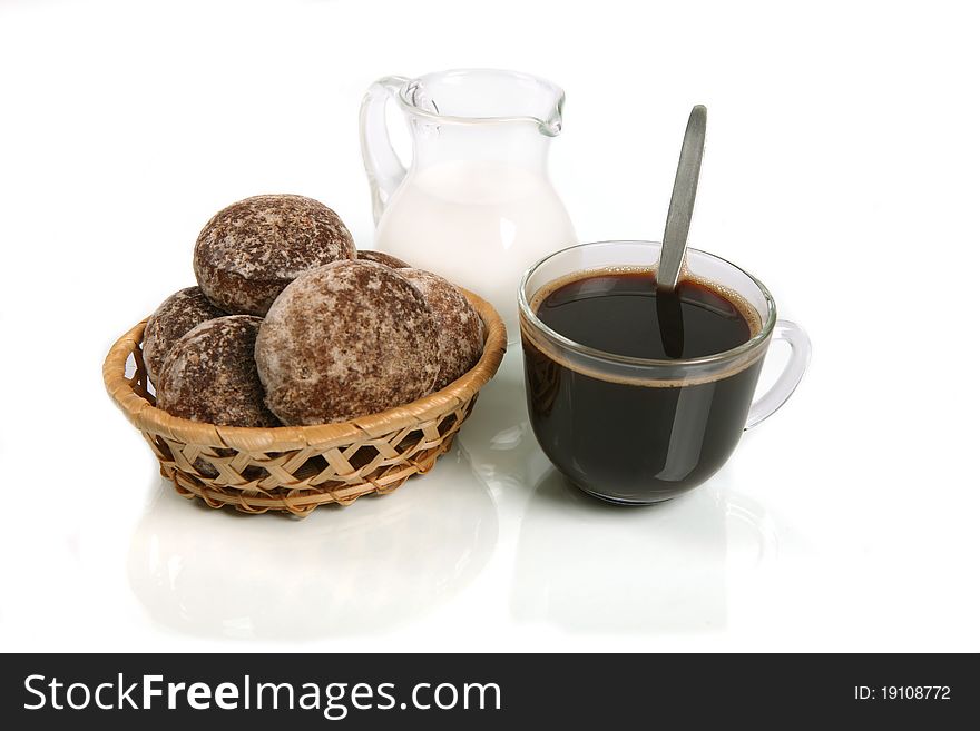 Coffee with milk and wafers against a dark background with reflexion