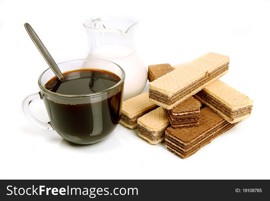 Coffee with milk and wafers on a white background with reflexion