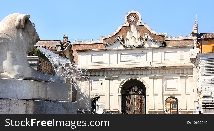 Gate of Piazza del Popolo and fountain lion in Rome Italy. Gate of Piazza del Popolo and fountain lion in Rome Italy