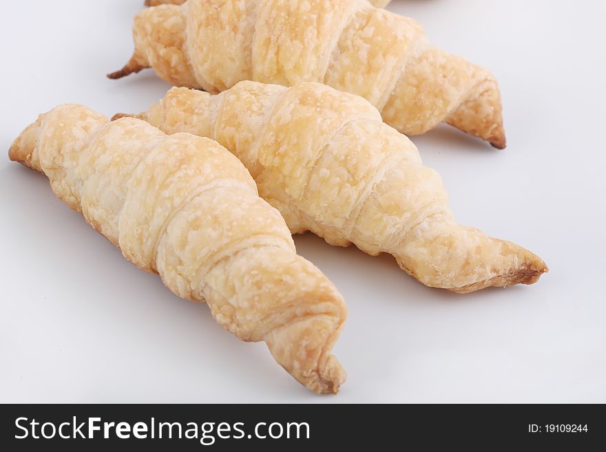 Croissants isolated on white plate