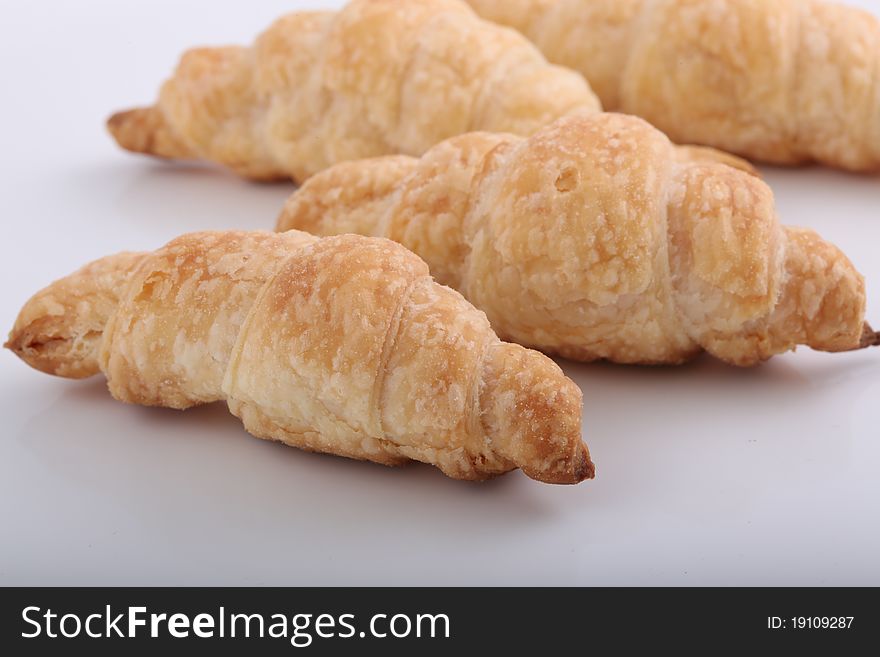 Croissants isolated on white plate