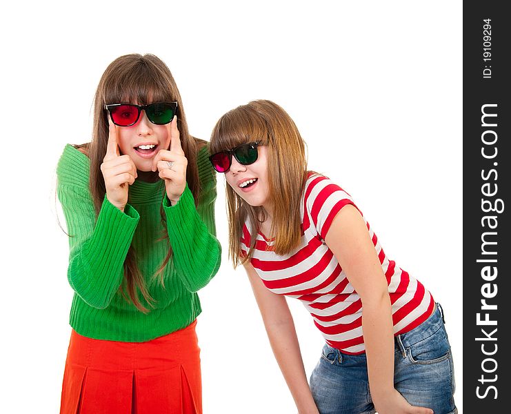 Sisters having fun while watching 3D movie isolated on white background