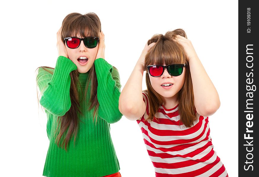 Sisters having fun while watching 3D movie isolated on white background