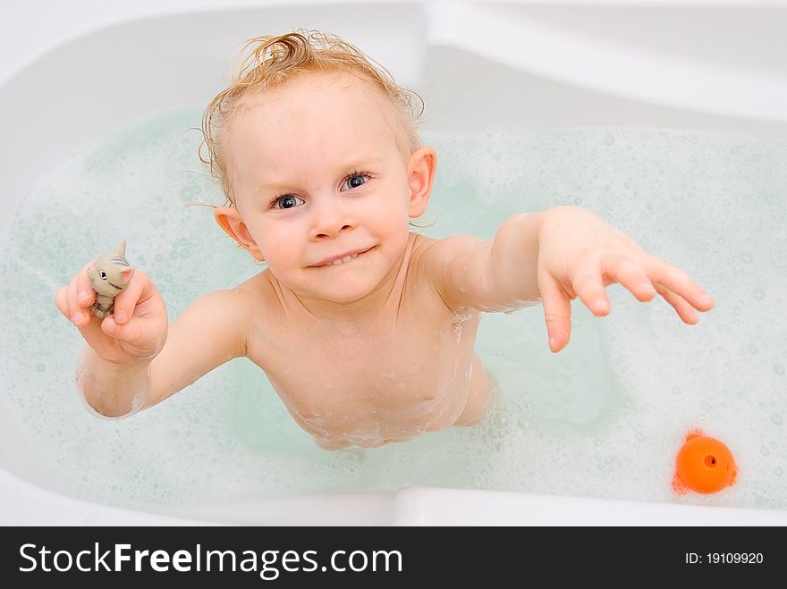 Cute 2 years old girl having bath fun