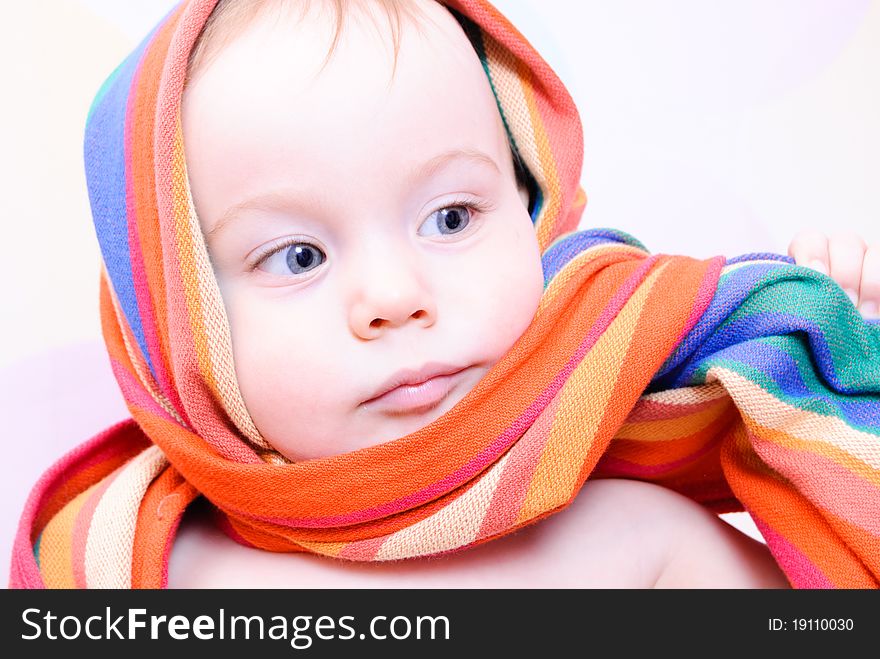 Cute 1 year child wrapped in baby sling. Cute 1 year child wrapped in baby sling