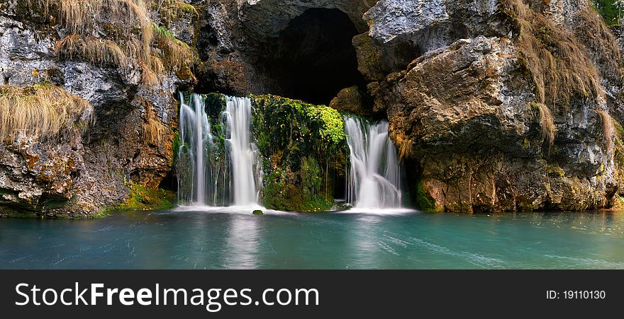 Falls of Atysh. A mountain stream following from a rock. Falls of Atysh. A mountain stream following from a rock.