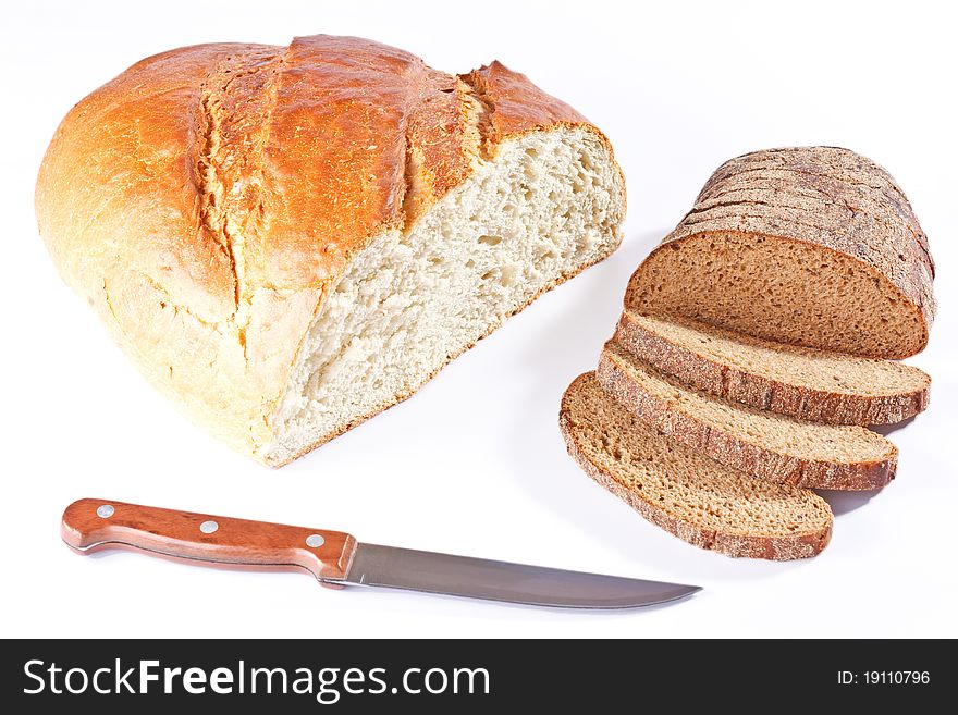 White Bread Loaf And Sliced Rye Loaf With Knife