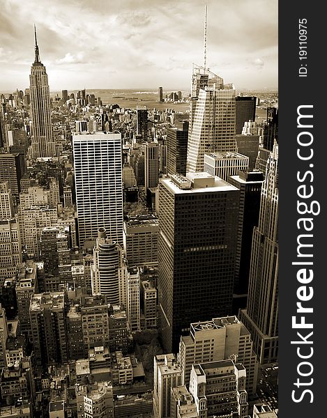 Vertical aerial photo of sepia colored Manhattan, Empire State Building in background. Vertical aerial photo of sepia colored Manhattan, Empire State Building in background