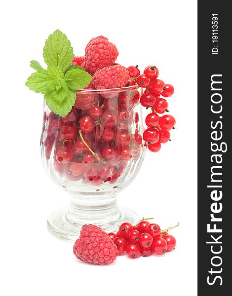 Summer dessert - red currants and raspberries isolated on white