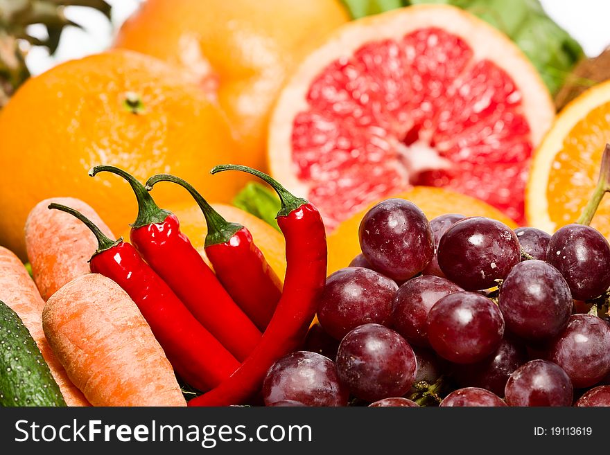 Full frame photograph of a broad variety of fruits and vegetables; colorful and plentiful