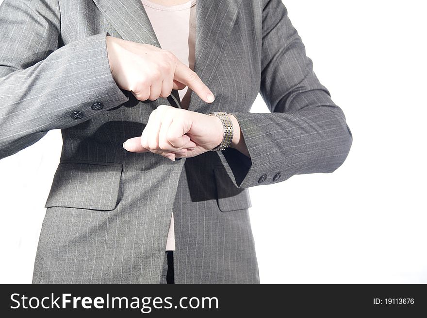 The young businesswoman pointing to clock