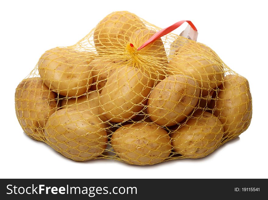 Mesh raw potatoes from the supermarket. Isolated on white background