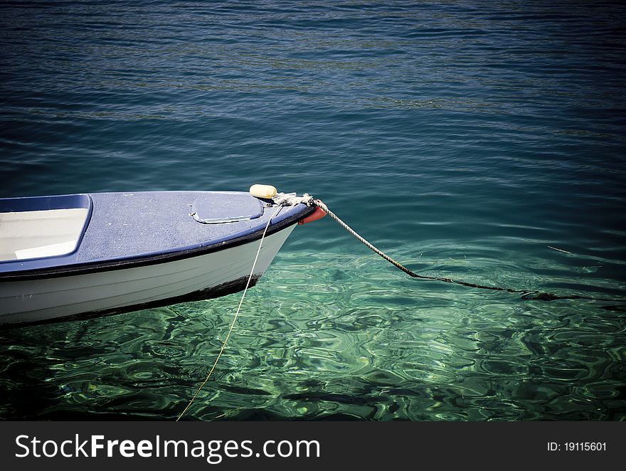 Small fishing boat floating on the water. Small fishing boat floating on the water