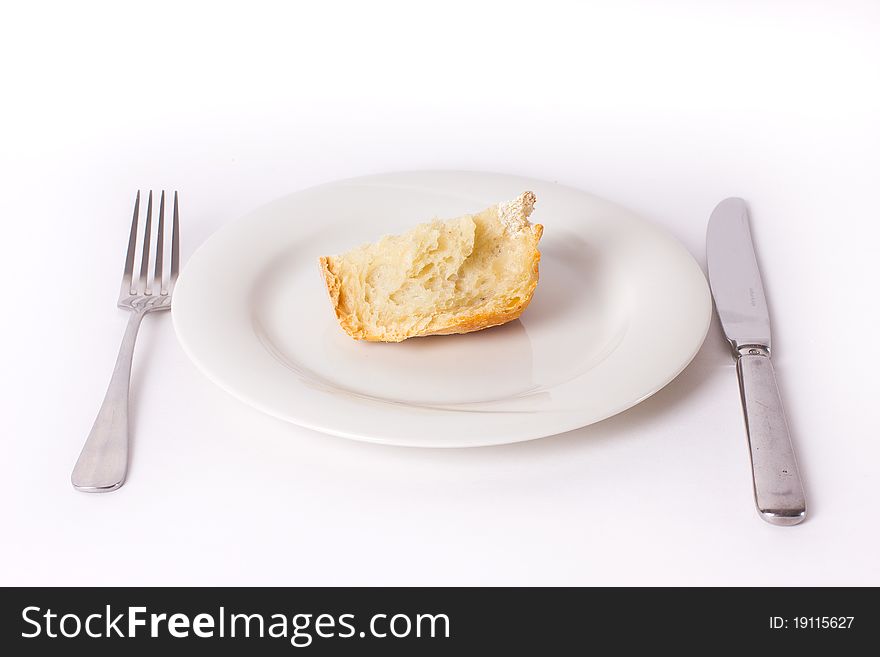 Bread on the plate with fork and knife