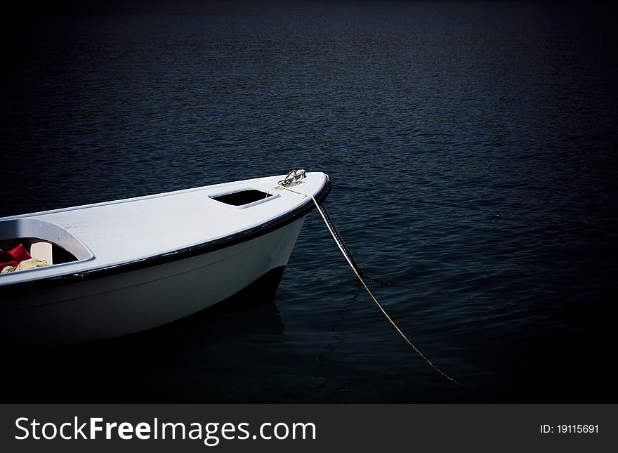 Small fishing boat floating on the water. Small fishing boat floating on the water