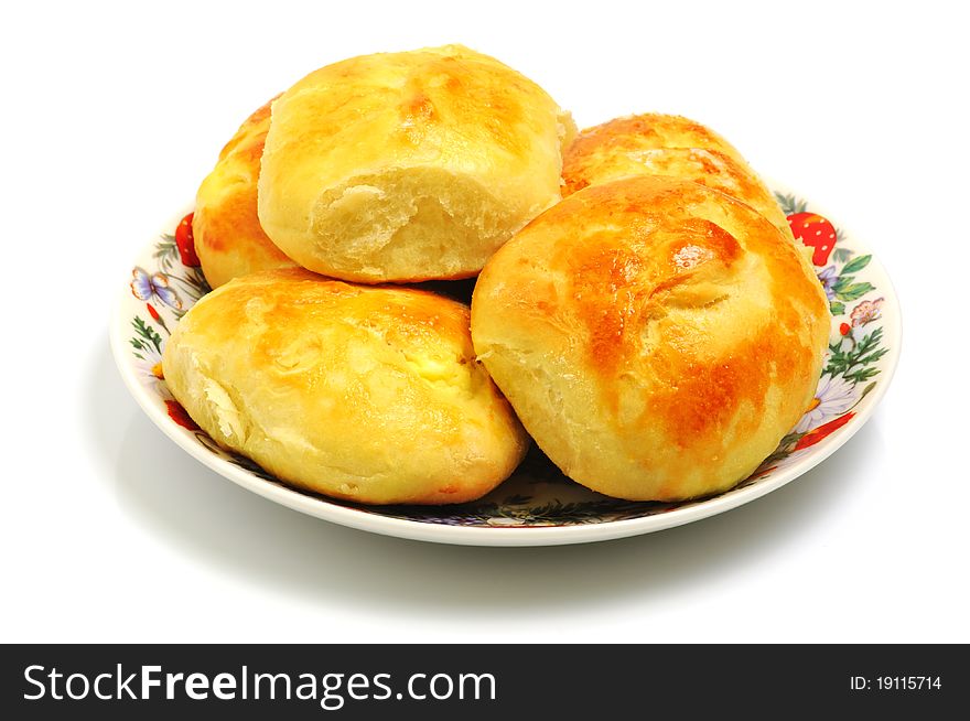 Few delicious freshly baked buns on a plate