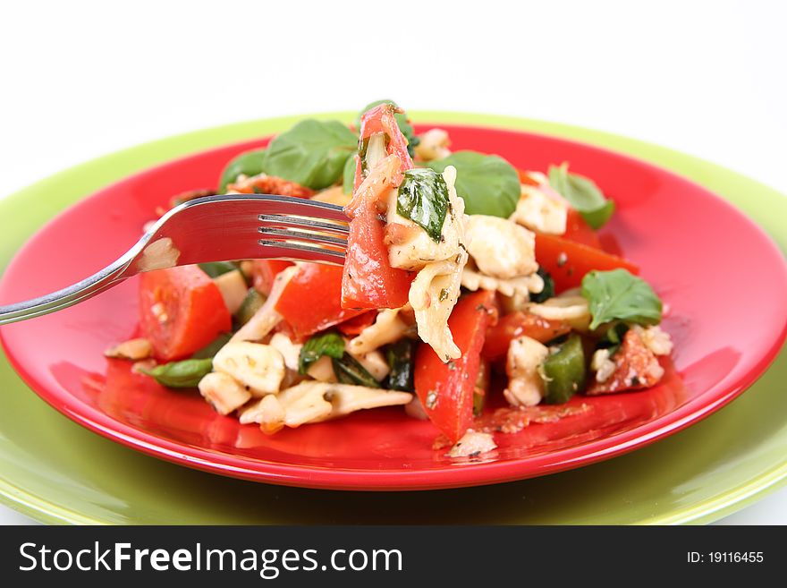 Salad being eaten with a fork