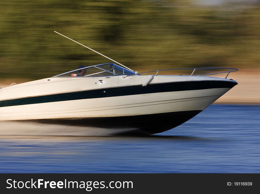 Speed motor boat is navigated on a river. Speed motor boat is navigated on a river