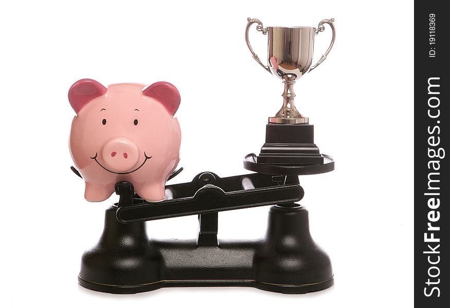 Piggy bank out weighing trophy