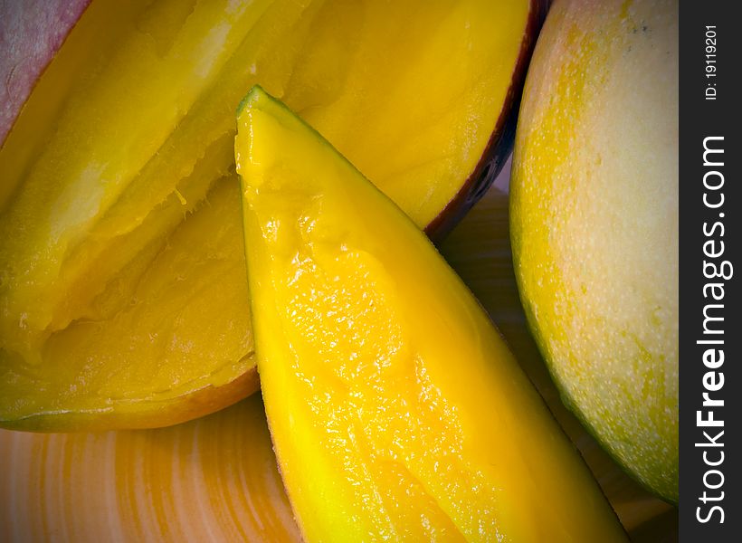 A closeup of sliced ripe mangoes. A closeup of sliced ripe mangoes