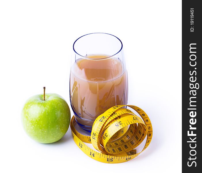 Still life with apple juice and a measuring tape. Still life with apple juice and a measuring tape