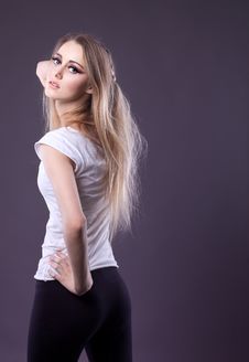 Young Beauty Girl In T-shirt Posing At Camera Royalty Free Stock Image Young Beauty Girl In T-shirt Posing At Camera Royalty Free Stock Image