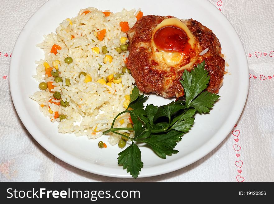 Lunch plate on the table with rice and vegetables and meat ball