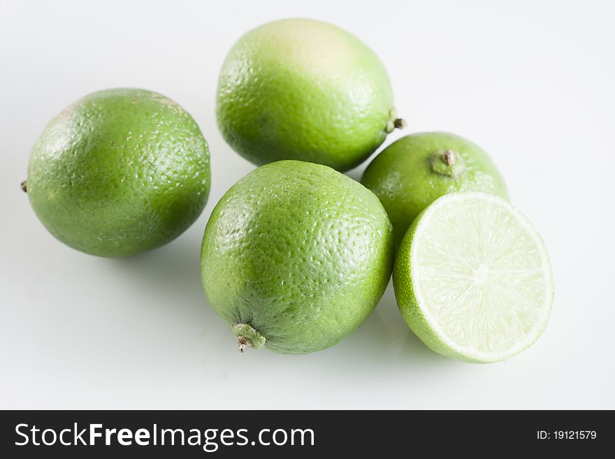 Close up of limes on white background