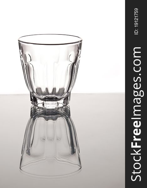 Empty Small Whisky Glass With Mirror Reflaction