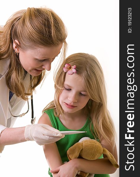 Lady doctor and eight year old girl both looking at a thermometer on white background. Lady doctor and eight year old girl both looking at a thermometer on white background