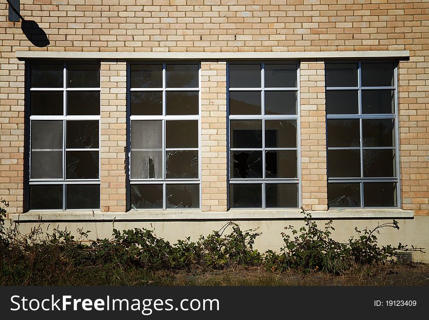 Broken window panes in deserted building at Willow Court, Tasmania. Broken window panes in deserted building at Willow Court, Tasmania.