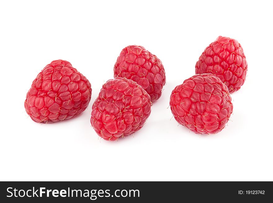 Ripe raspberries on white background