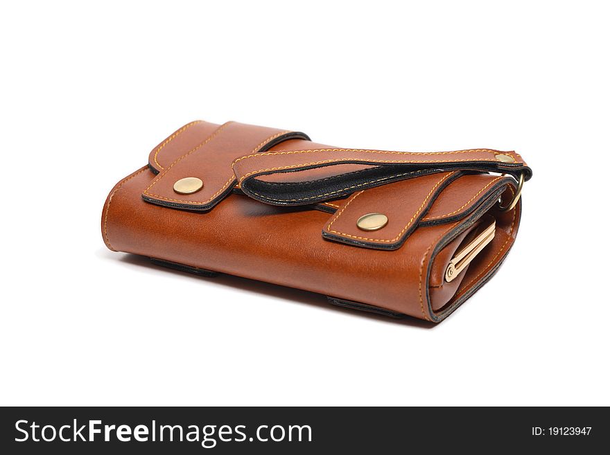 Modern brown leather change purse lying on white background. Modern brown leather change purse lying on white background