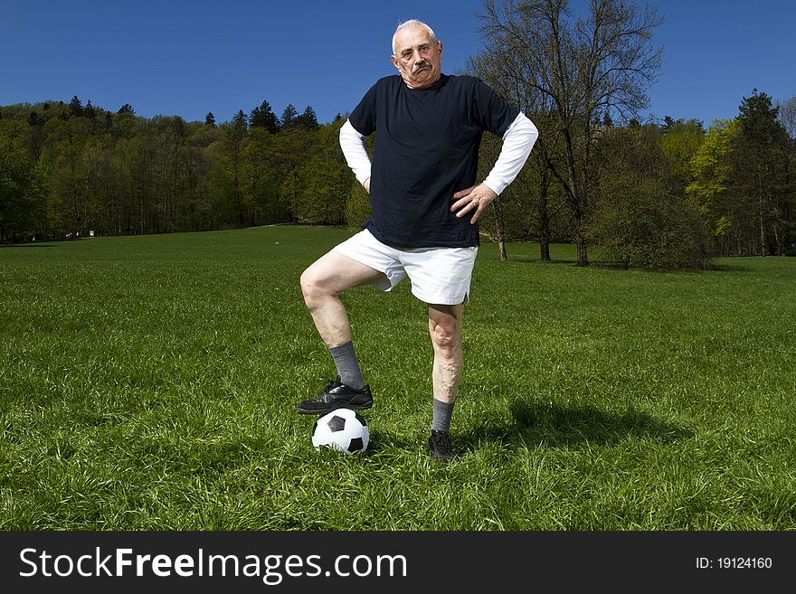 Senior football player in the park