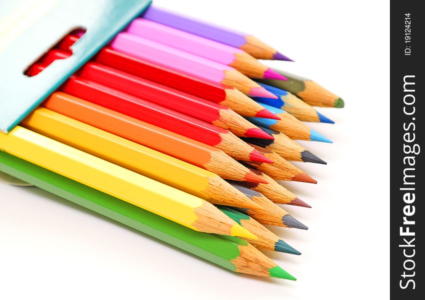 Box with color pencils isolated