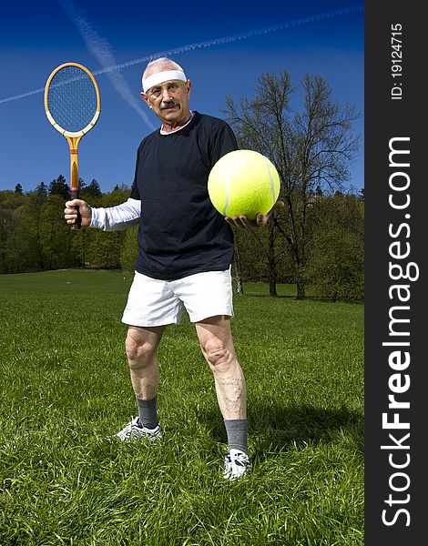 Senior Man Playing Tennis