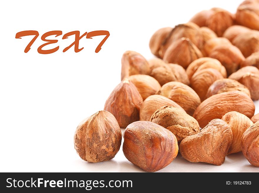 Brown shelled hazelnuts isolated on white background