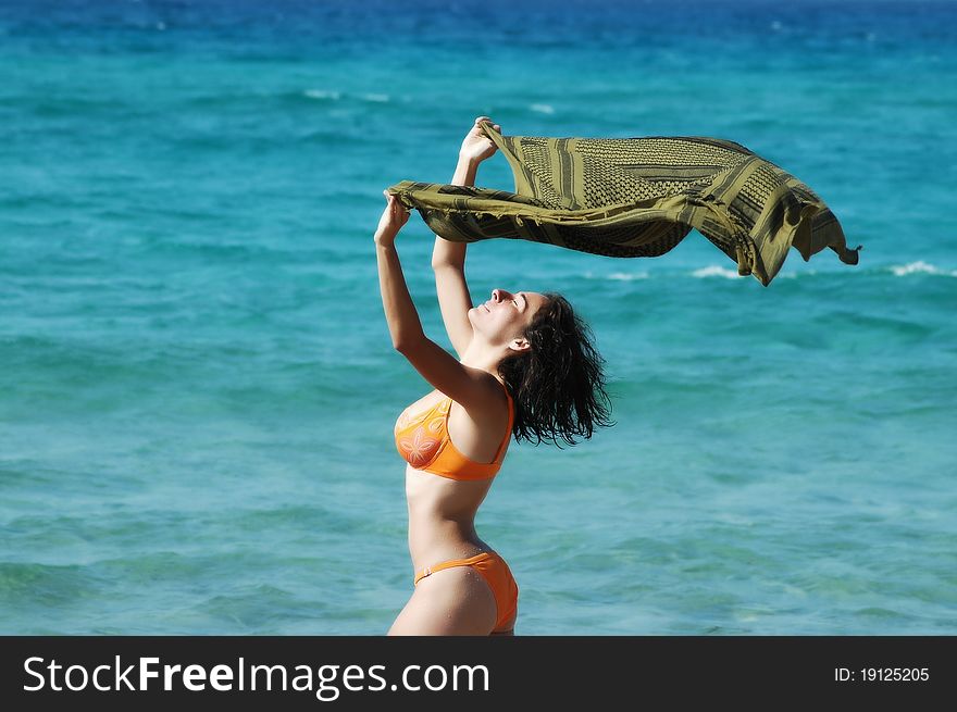 Beautiful young woman on the beach