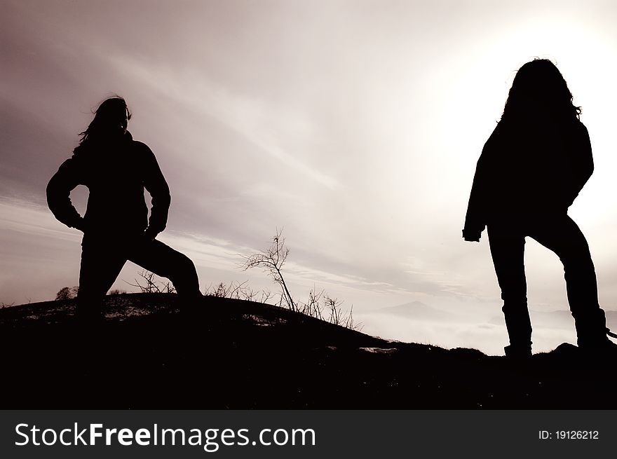 Silhouette Of Rockers In The Darkness