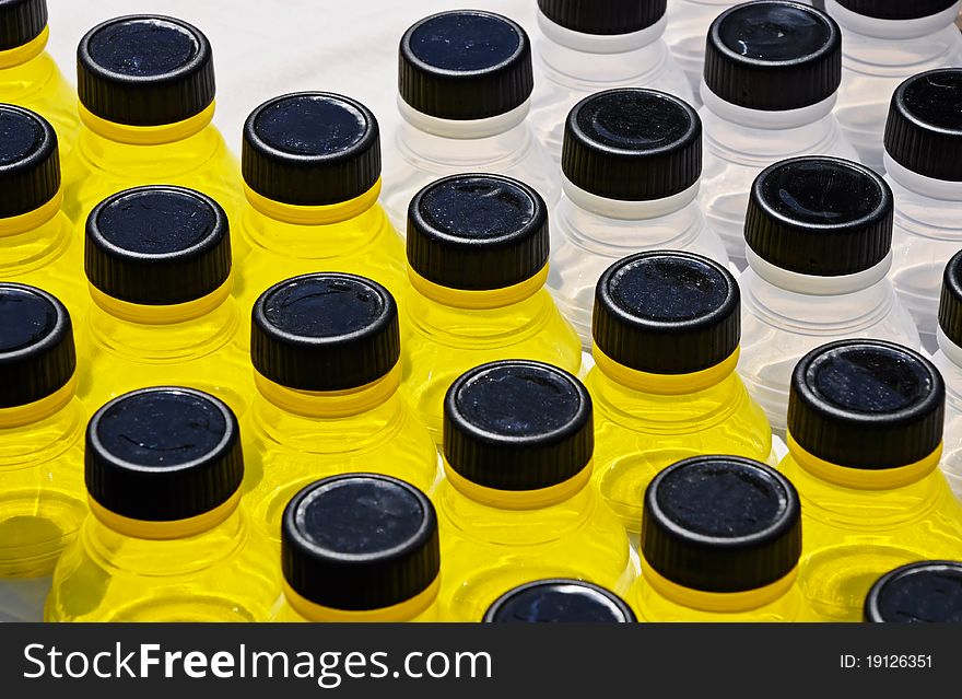 Abstract of yellow and clear glass containers used in range of health and beauty environments. Abstract of yellow and clear glass containers used in range of health and beauty environments