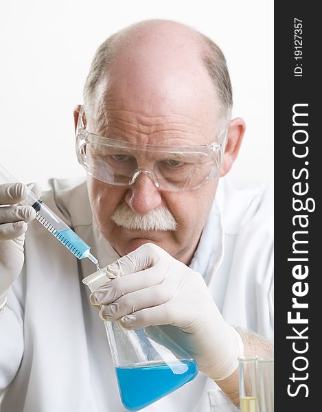 Scientist working with chemicals isolated on white