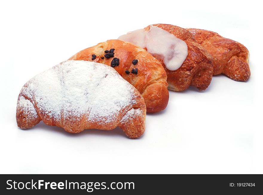 Different types of croissants isolated on white