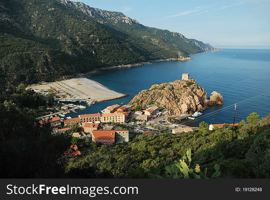 Beach and genoese tower in Porto, Corsica, France